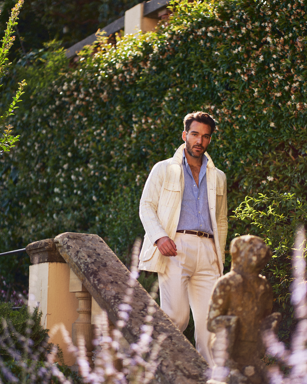 A young gentleman is wearing in a stylish summer safari jacket 