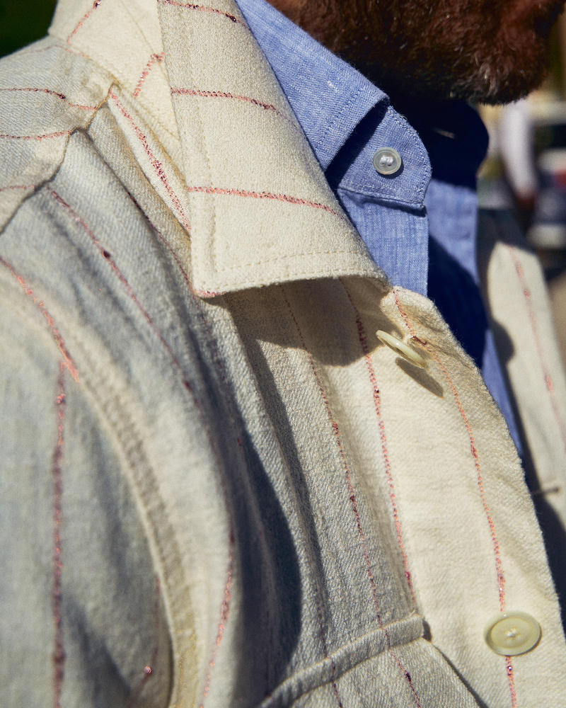 
                  
                    A close up of the collar of the men's safari jacket
                  
                