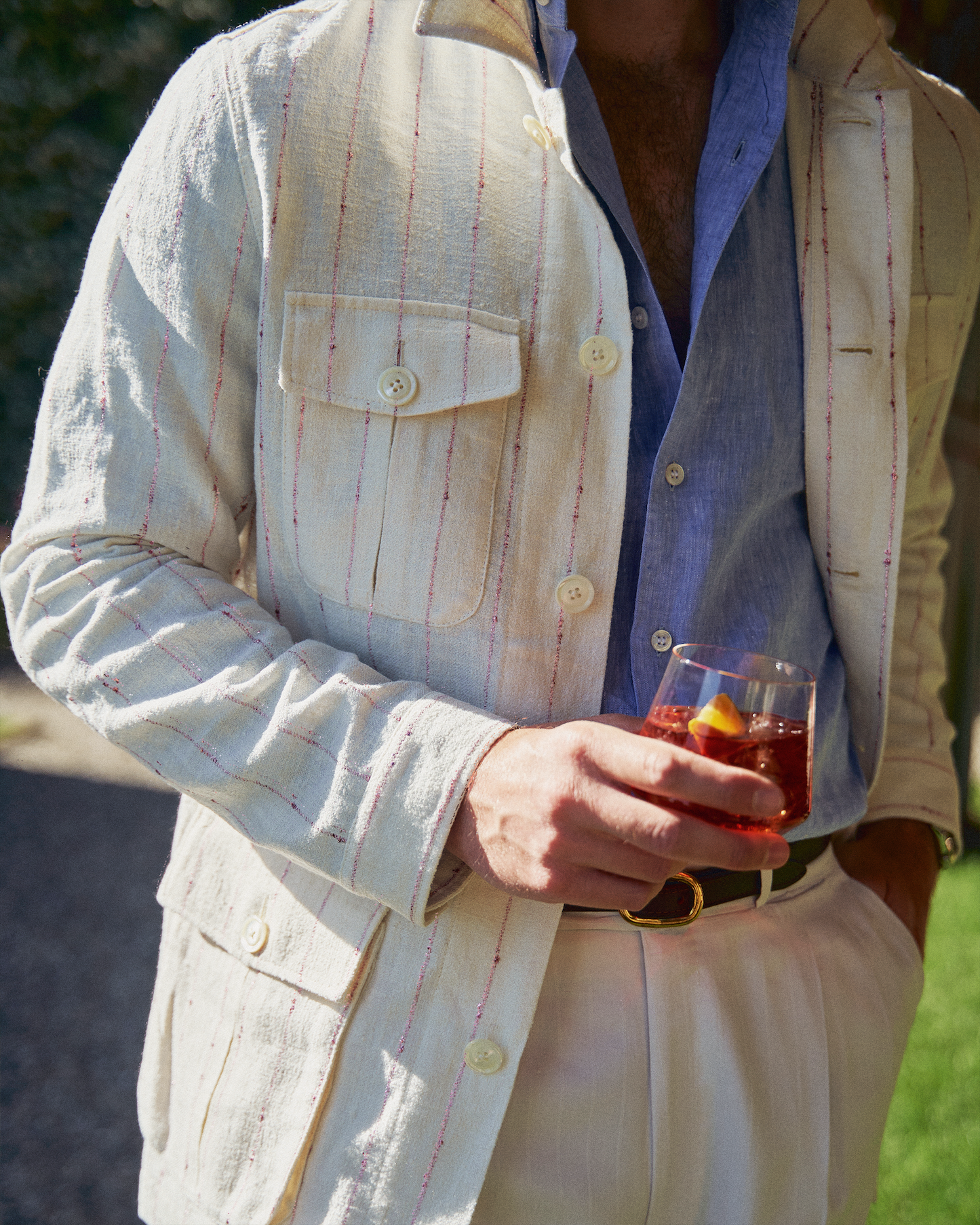 
                  
                    A close-up of a beautiful summer men's safari jacket
                  
                